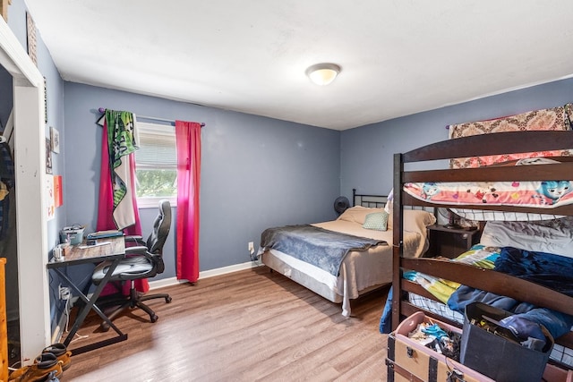 bedroom with hardwood / wood-style floors