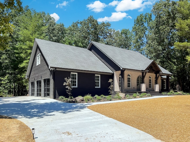 view of front of house with a garage and a porch