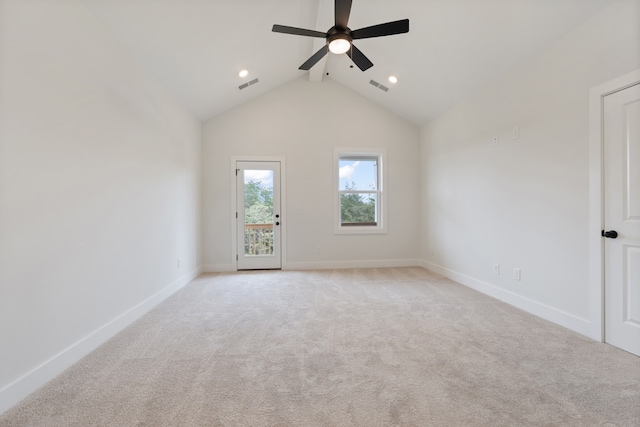 carpeted empty room featuring ceiling fan and lofted ceiling