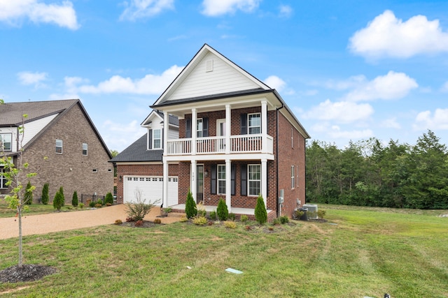 view of front of house with a balcony and a front lawn