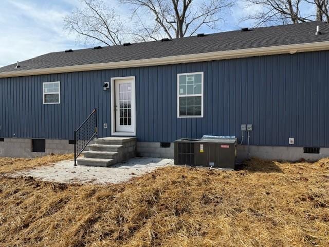 rear view of house with central AC