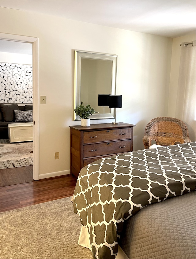 bedroom with hardwood / wood-style floors