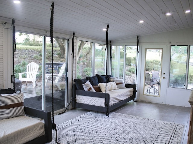 sunroom / solarium with wood ceiling and vaulted ceiling