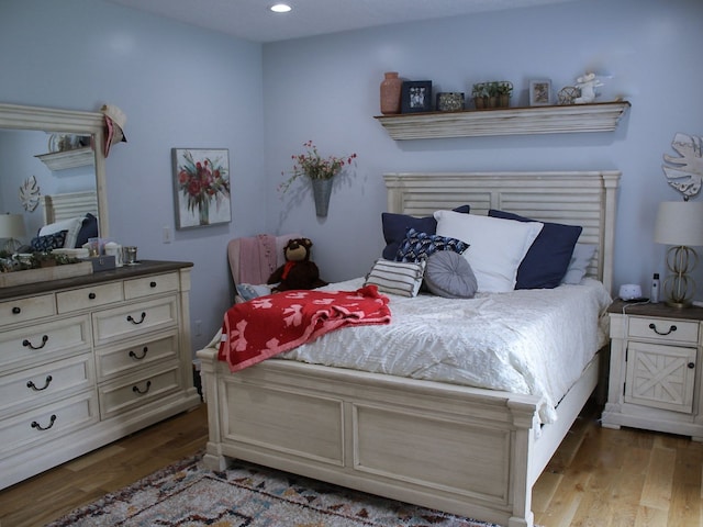 bedroom featuring hardwood / wood-style flooring