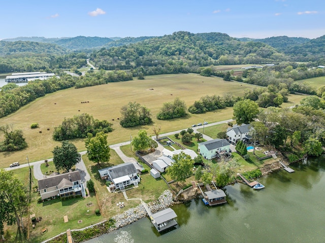 birds eye view of property with a rural view and a water view