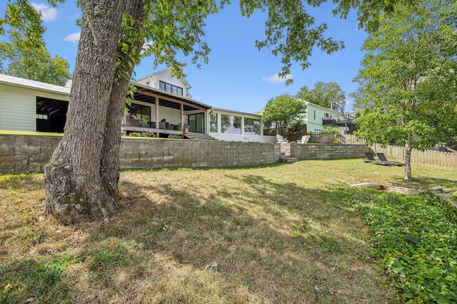 view of yard featuring a sunroom