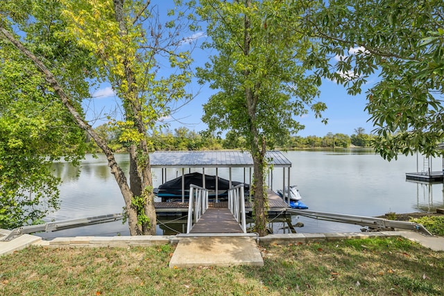 dock area with a water view