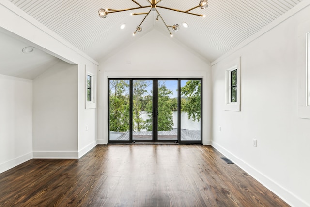 empty room featuring wooden ceiling, an inviting chandelier, a wealth of natural light, and dark wood-type flooring