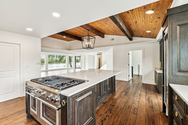 kitchen with lofted ceiling with beams, a kitchen island, dark brown cabinetry, and dark wood-type flooring