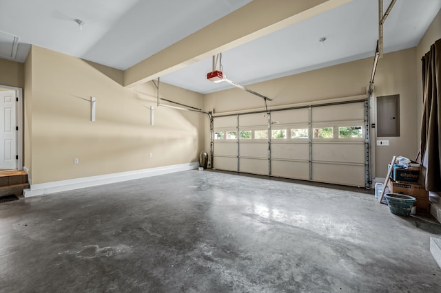 garage with a garage door opener and electric panel