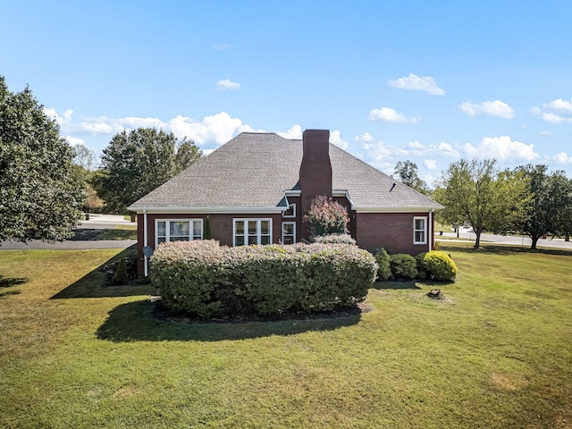 view of home's exterior featuring a yard