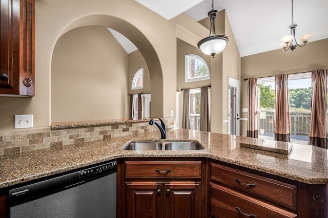 kitchen with stainless steel dishwasher, vaulted ceiling, sink, and plenty of natural light