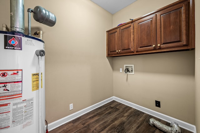 laundry area with gas water heater, dark hardwood / wood-style floors, cabinets, and hookup for a washing machine