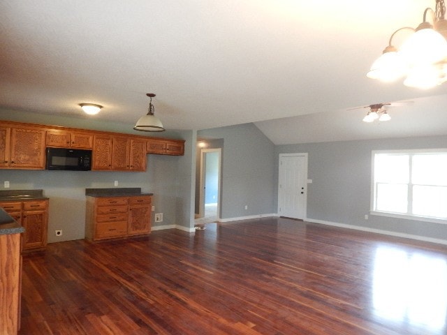 kitchen with a notable chandelier and dark hardwood / wood-style floors