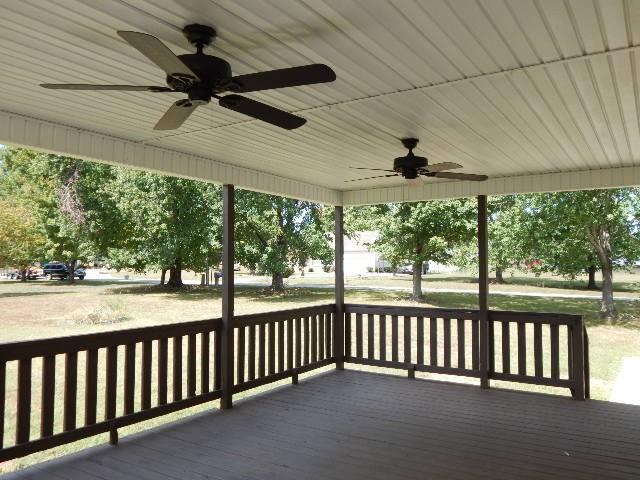 wooden terrace with ceiling fan