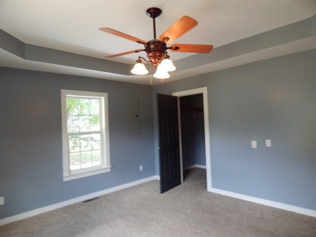 carpeted empty room with ceiling fan