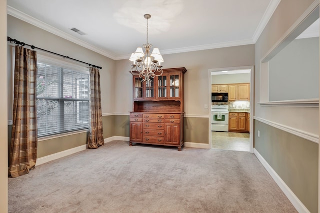 dining room with ornamental molding, a notable chandelier, and light colored carpet