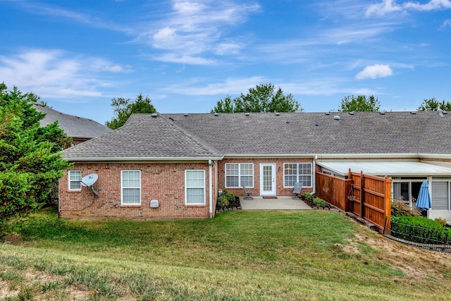 back of house featuring a yard and a patio