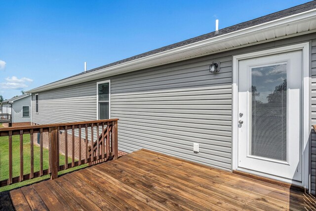 wooden deck with a lawn