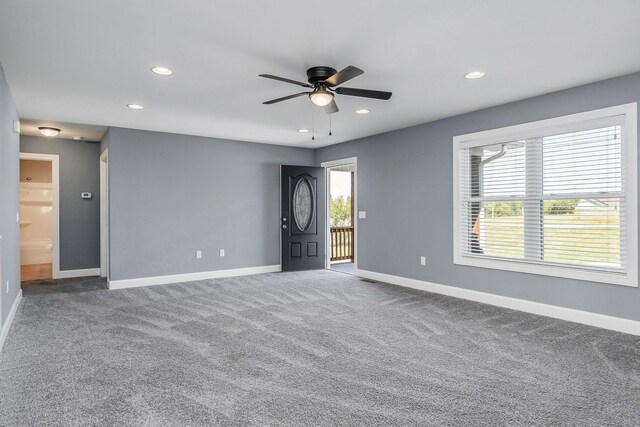 unfurnished room featuring carpet and ceiling fan