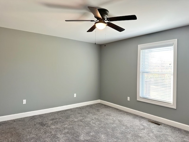 carpeted empty room with ceiling fan