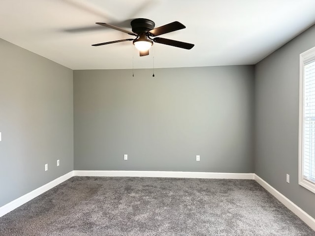 carpeted empty room featuring ceiling fan and a healthy amount of sunlight