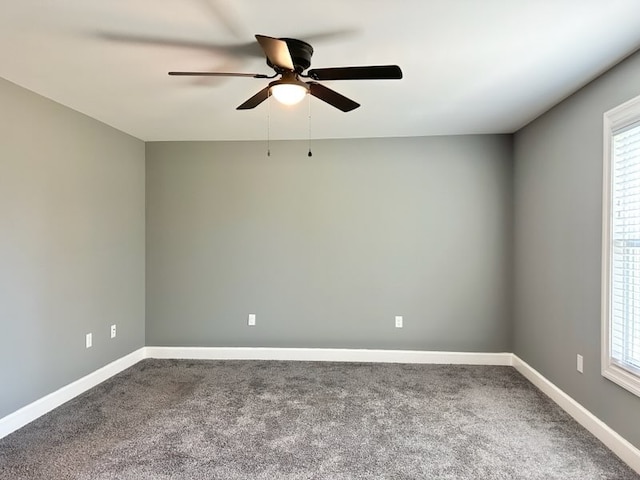 empty room featuring carpet flooring and ceiling fan