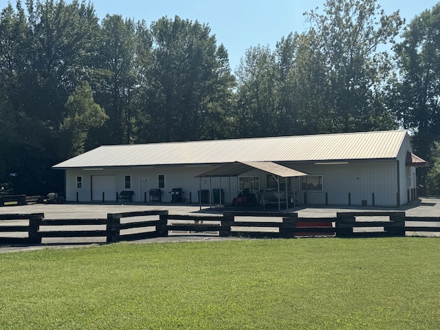 back of property with a yard and a wooden deck