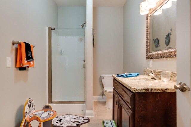 bathroom with vanity, an enclosed shower, and toilet