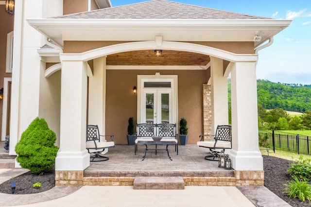 doorway to property with a patio and french doors