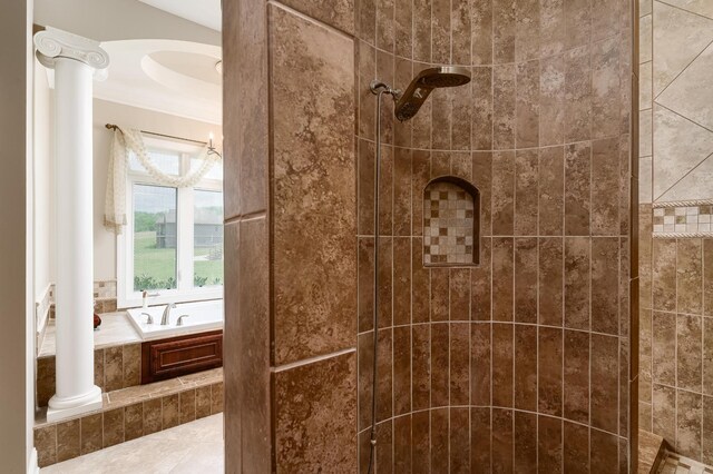 bathroom with shower with separate bathtub, crown molding, and ornate columns