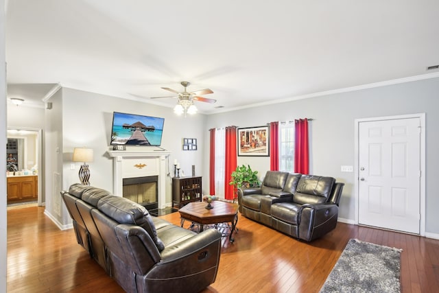 living room featuring ceiling fan, crown molding, and hardwood / wood-style floors