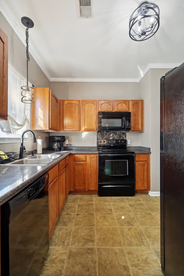 kitchen featuring sink, black appliances, hanging light fixtures, and ornamental molding