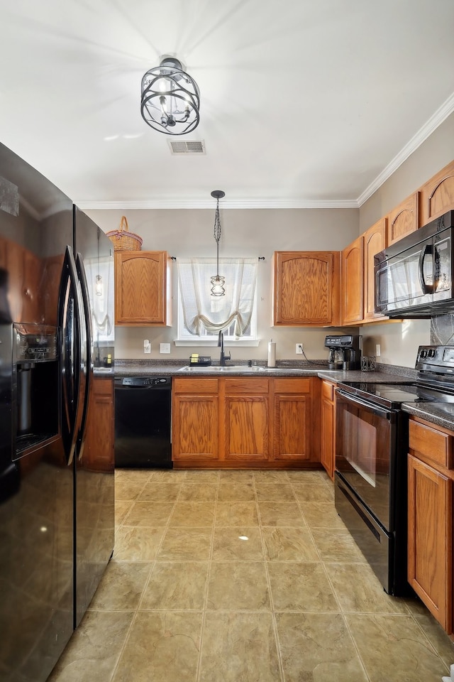 kitchen with sink, black appliances, hanging light fixtures, and ornamental molding