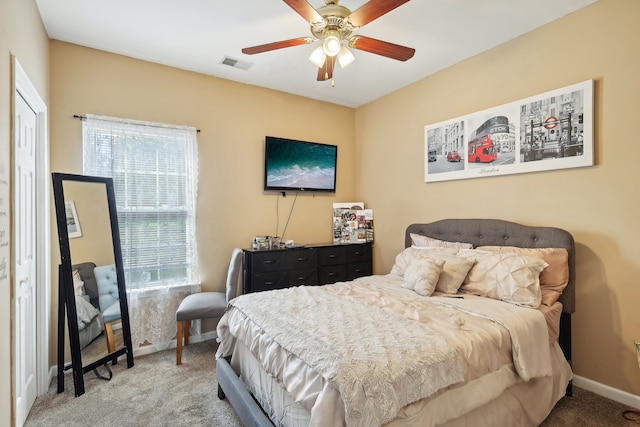 bedroom featuring a closet, ceiling fan, and carpet floors