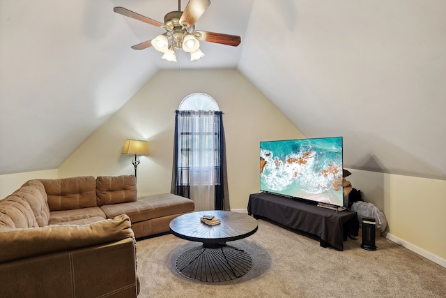 living room with ceiling fan, vaulted ceiling, and light colored carpet