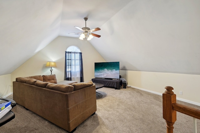 living room featuring ceiling fan, lofted ceiling, and light colored carpet