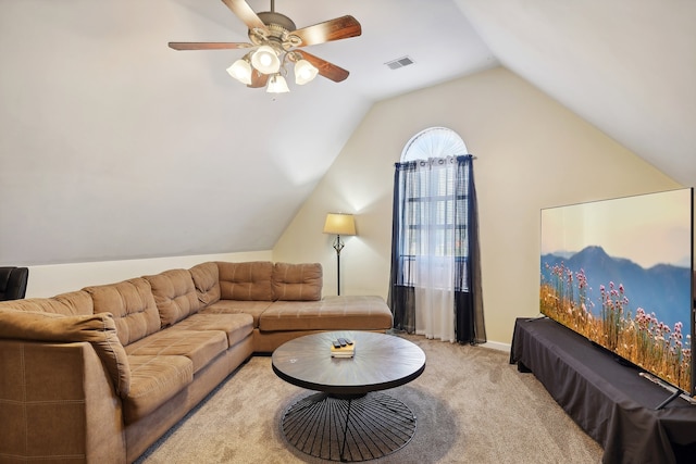 living room with vaulted ceiling, light colored carpet, and ceiling fan