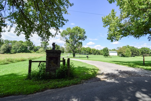 view of property's community featuring a yard