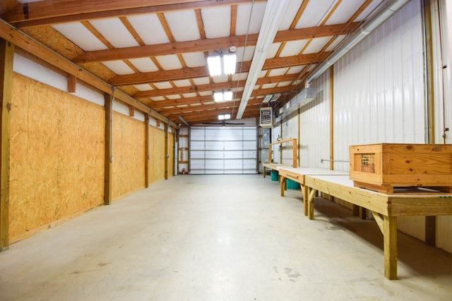 garage featuring wooden walls