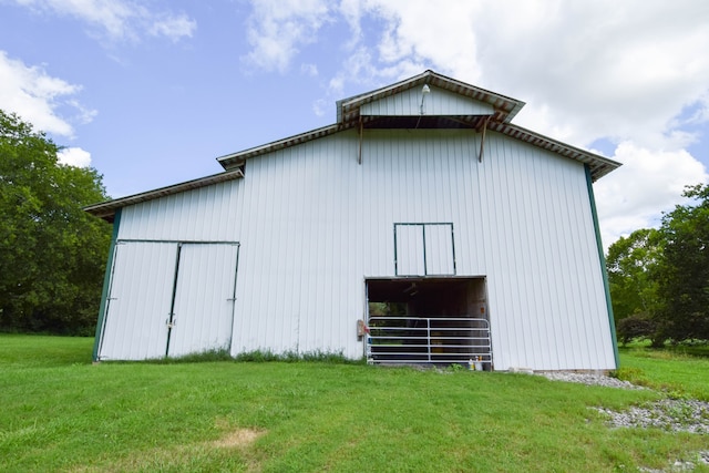 view of outbuilding featuring a yard