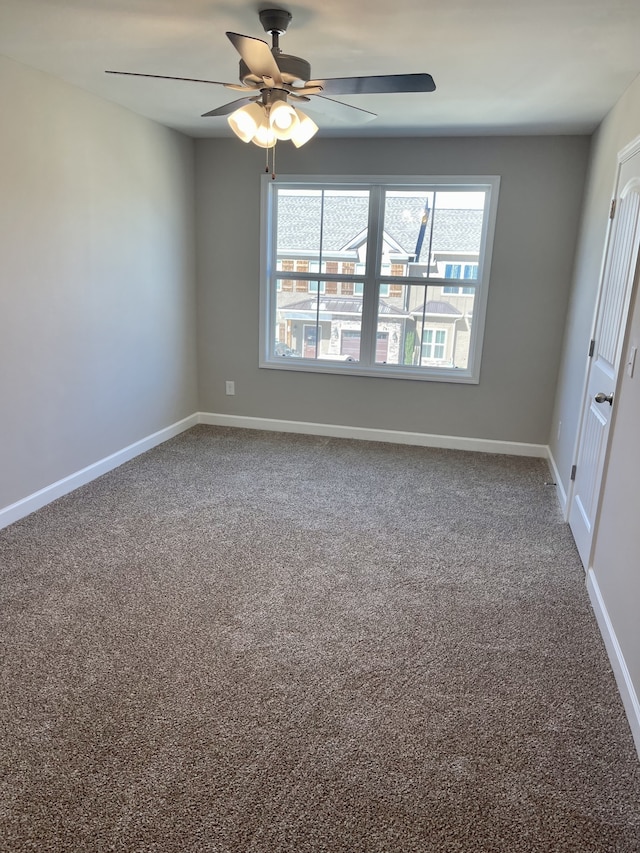 unfurnished room featuring carpet and ceiling fan