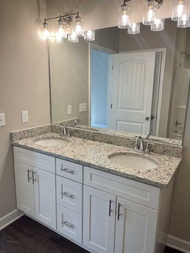 bathroom featuring vanity and hardwood / wood-style floors