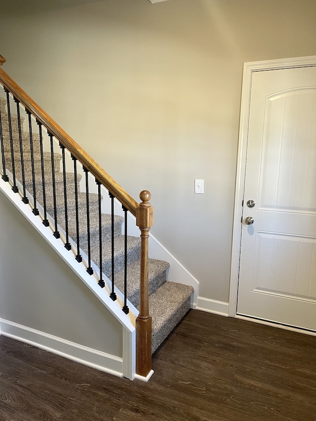 staircase featuring hardwood / wood-style floors