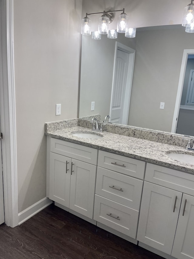 bathroom with hardwood / wood-style flooring and vanity