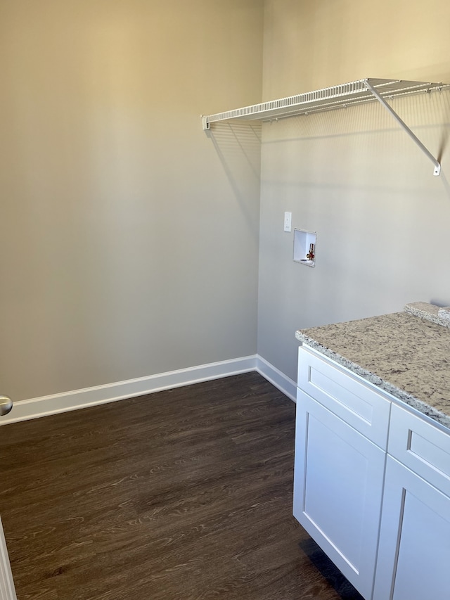 laundry room with hookup for a washing machine and dark wood-type flooring