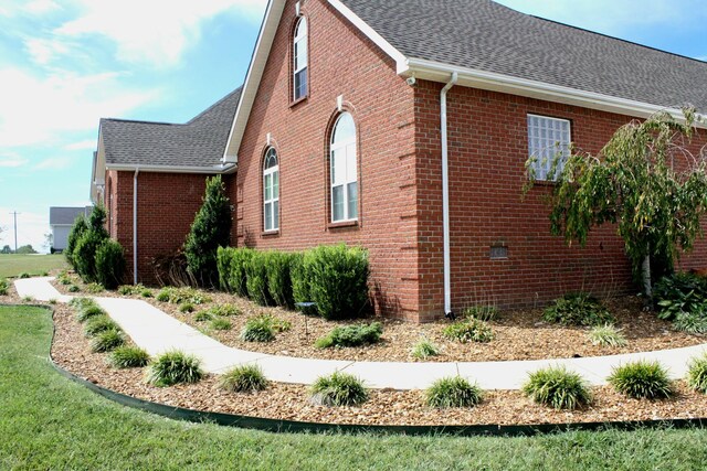 view of home's exterior featuring a lawn