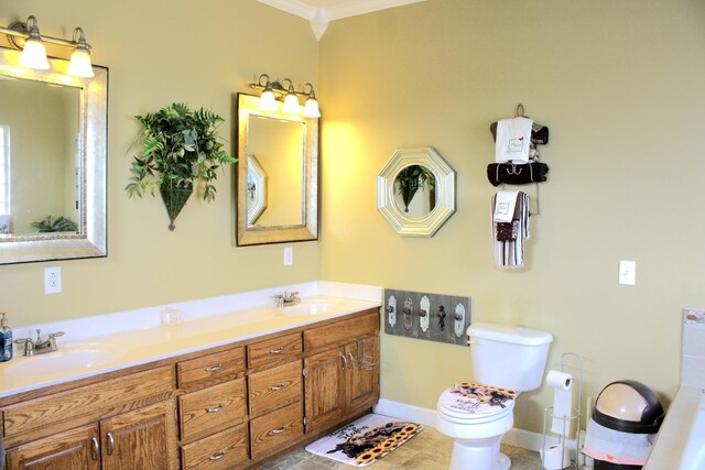 bathroom featuring vanity, crown molding, toilet, and tile patterned flooring