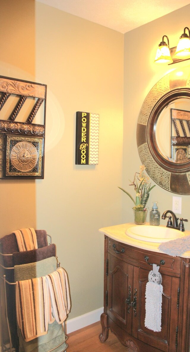 bathroom with wood-type flooring and vanity