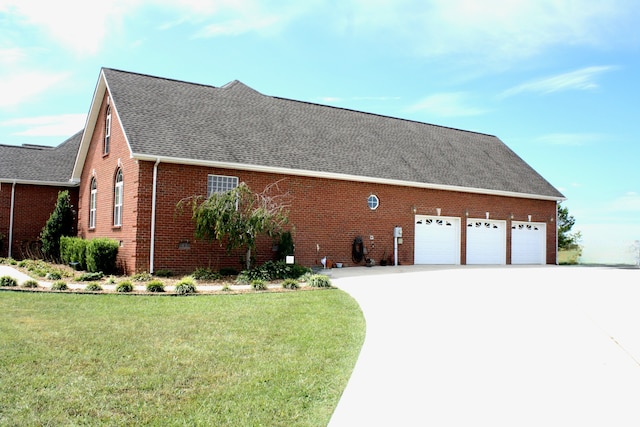 view of front of property with a front yard and a garage